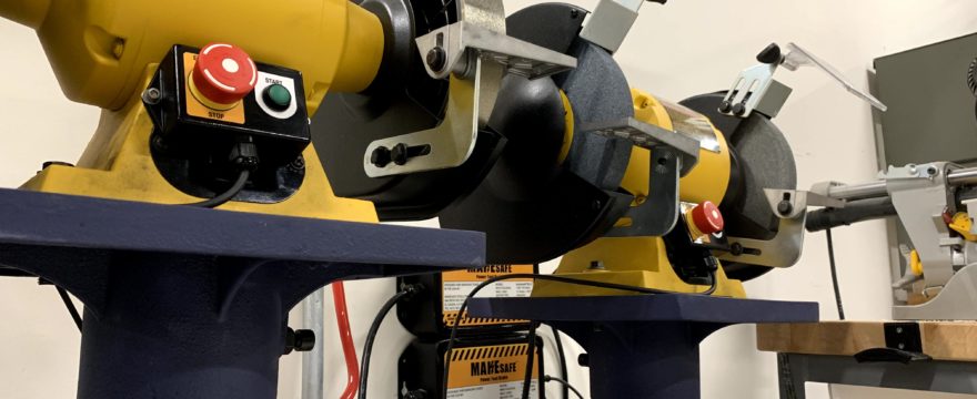 MAKESafe Power Tool Brake, e-stop, and power outage protection installed on bench grinder at Rockefeller University