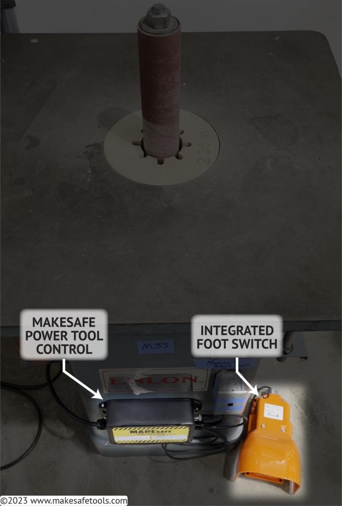 An image of an Enlon Oscillating Spindle Sander with highlights over our MAKESafe Power Tool Control and Foot Switch