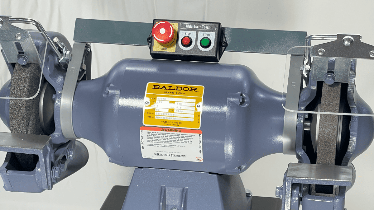 straddle mount for pushbutton control panel installed on bench grinder